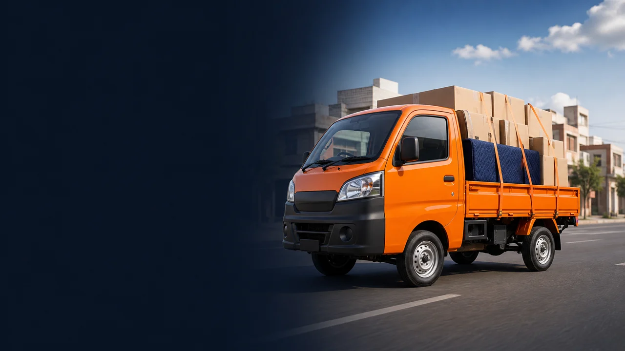 Orange goods vehicle carrying secured boxes